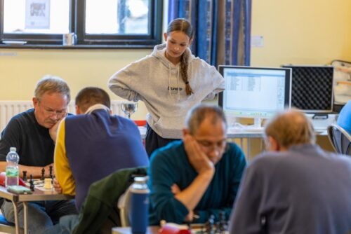 Games in progress on a club night, with the results desk behind